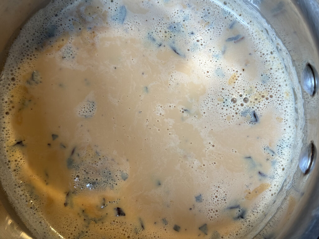 Bubbling homemade chai in a pot.